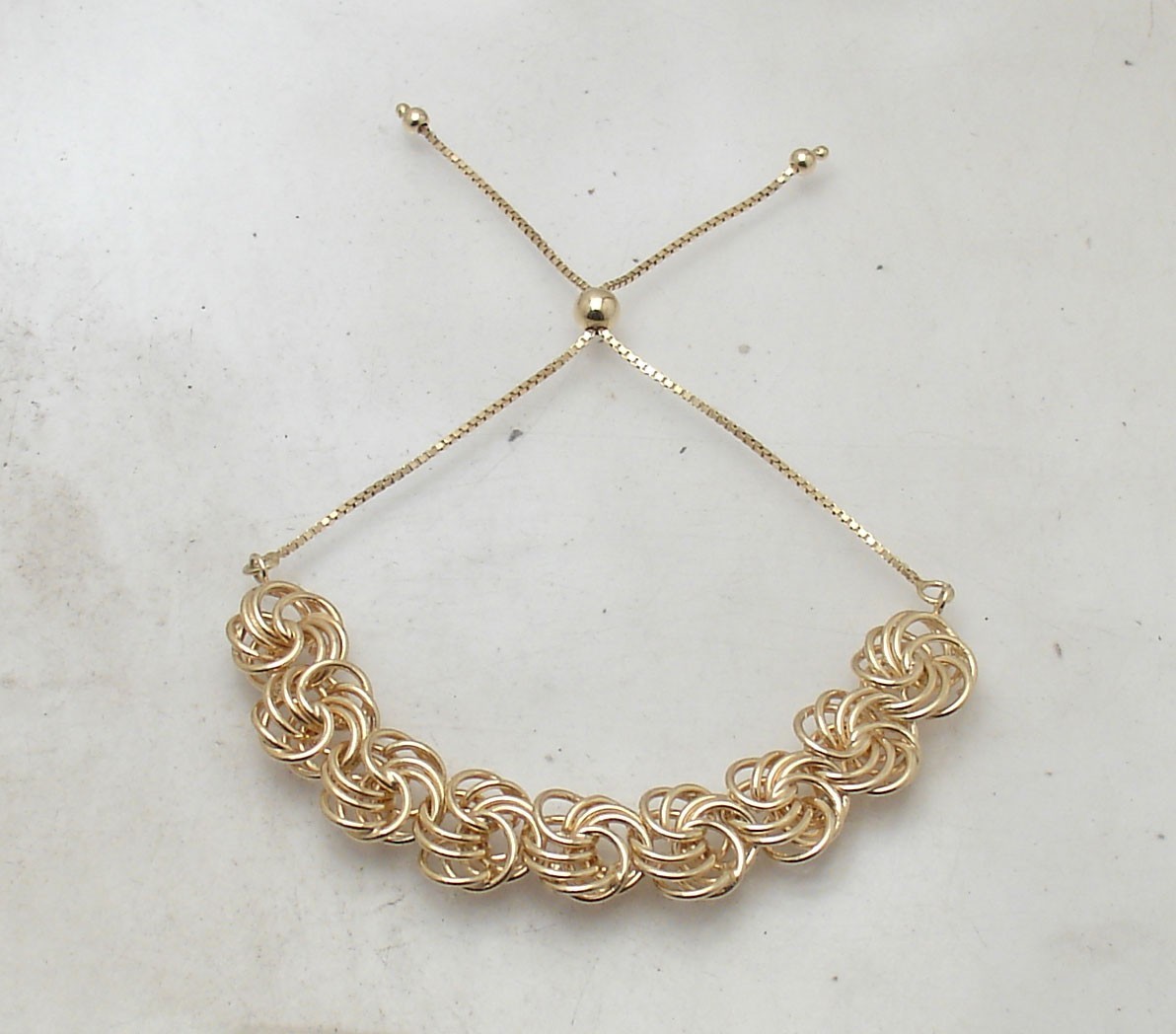Technibond Adjustable Rosette Love Knot Bracelet 14K Yellow Gold Plated Silver