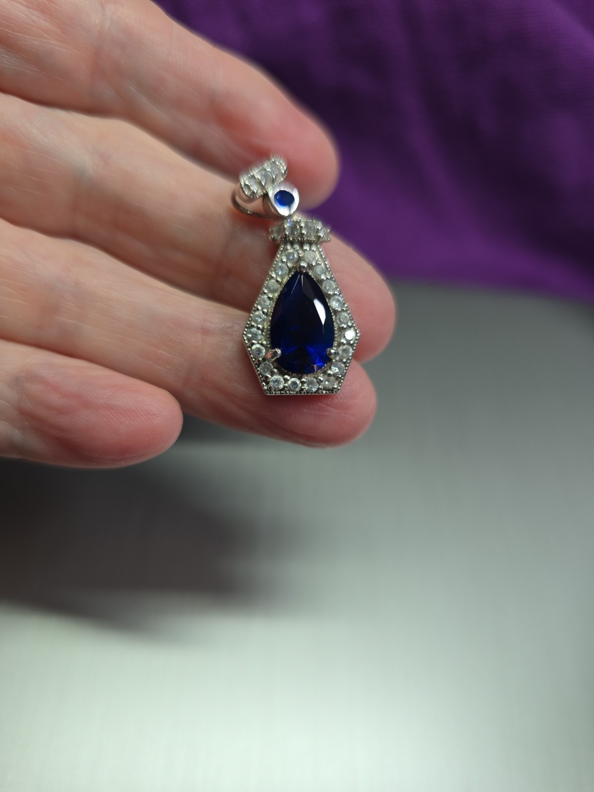 Sterling .925 Created Pear Shape Sapphire And Clear Accent Stones Pendant