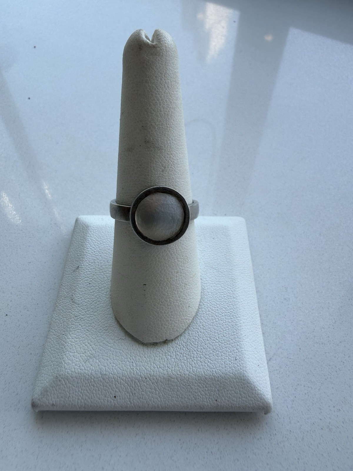 Sterling Silver Ring With a Bezel Set Matte Opaque Stone, Size 8 1/4” Approx.