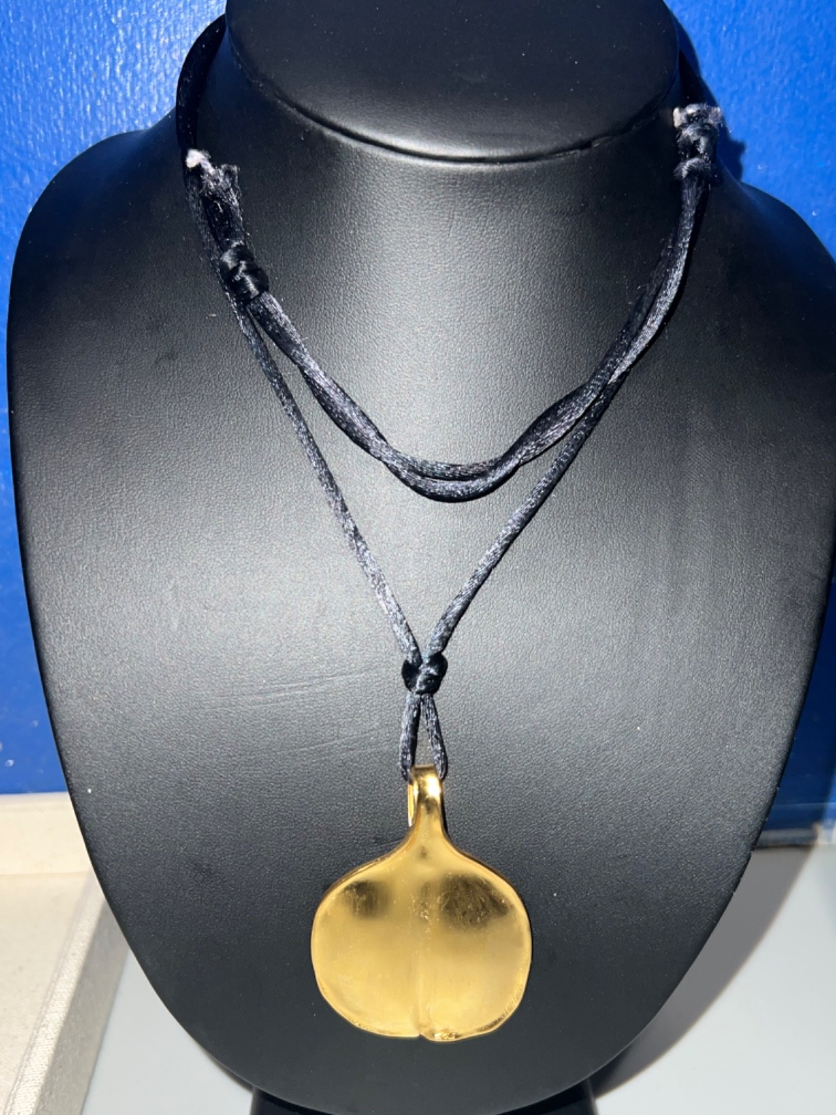 “NN” Sterling Matte Gold Leaf-shaped Pendant on Blue Silk Cord Necklace