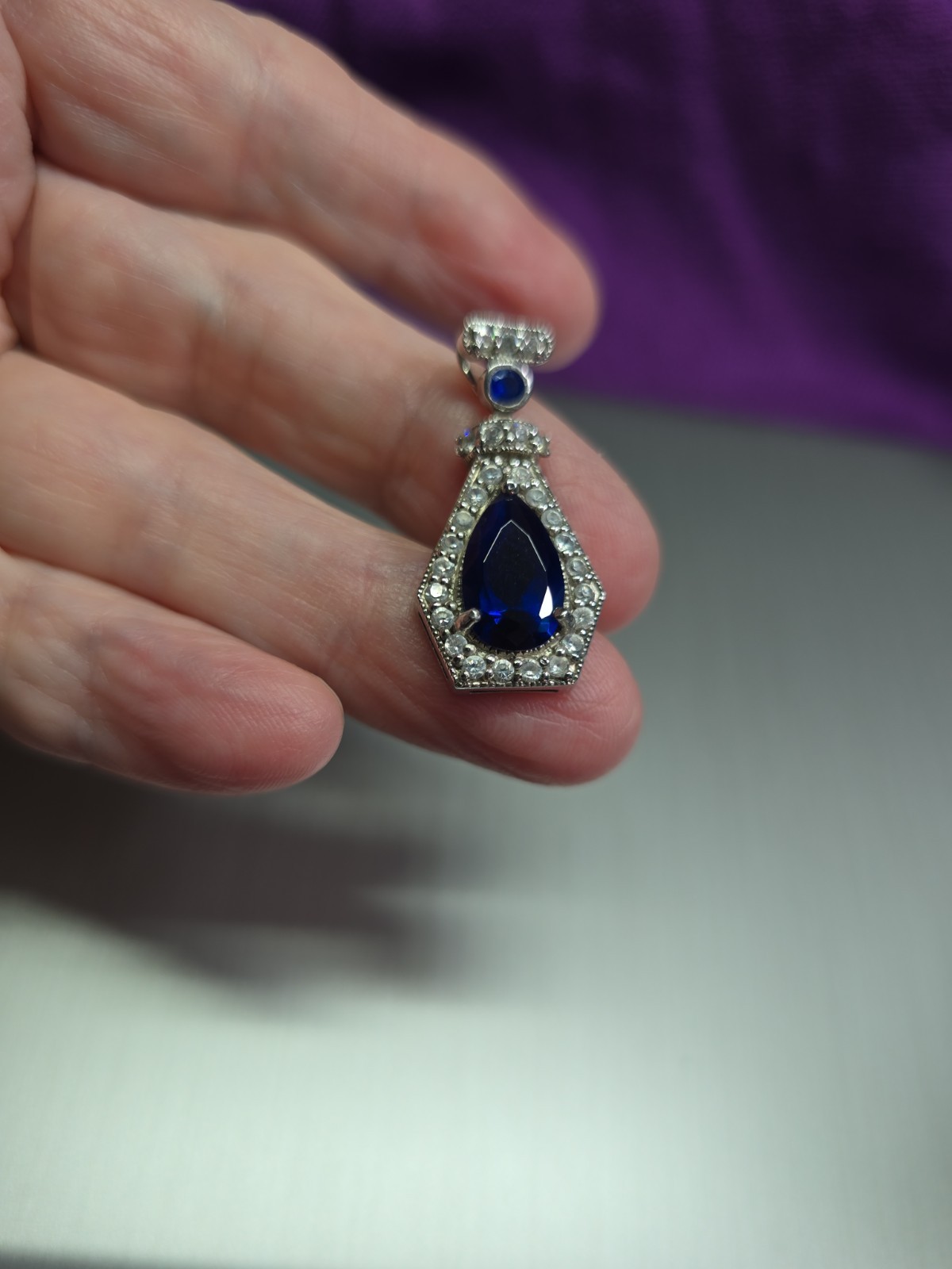 Sterling .925 Created Pear Shape Sapphire And Clear Accent Stones Pendant