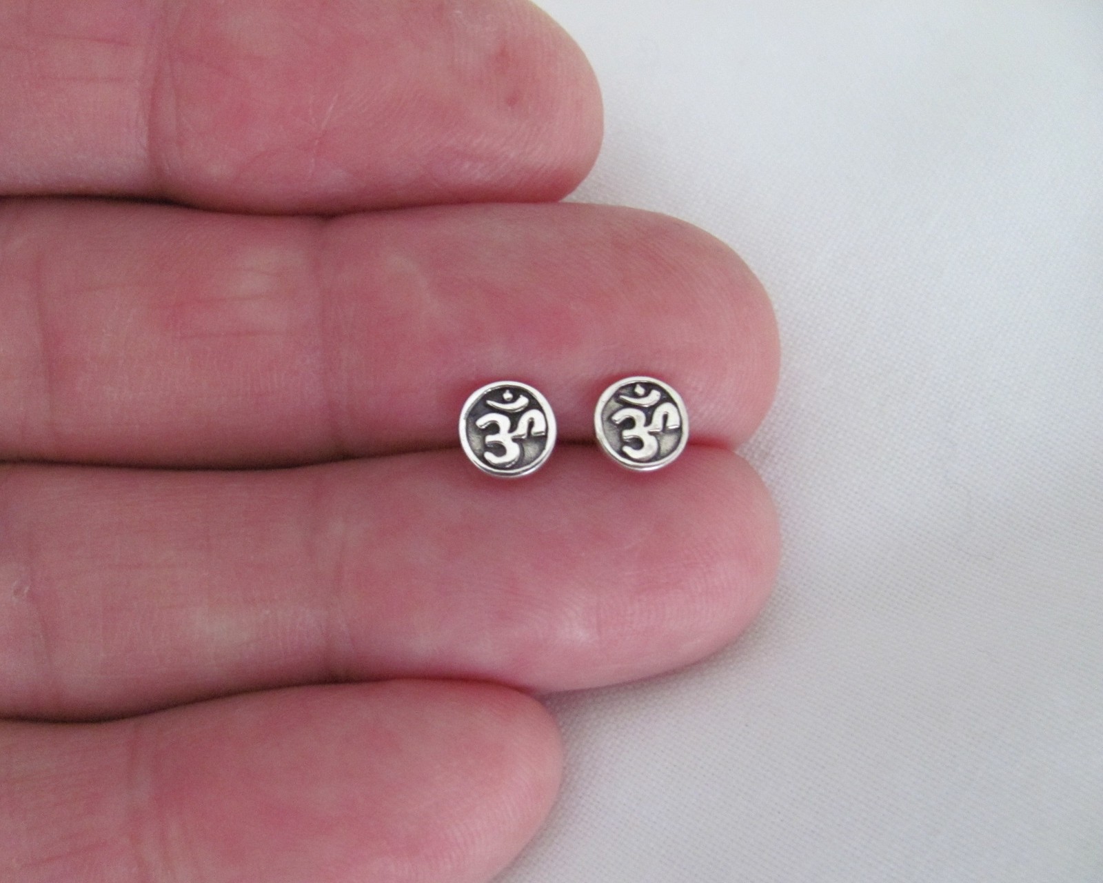 Sterling Silver 6mm ohm post stud earrings.