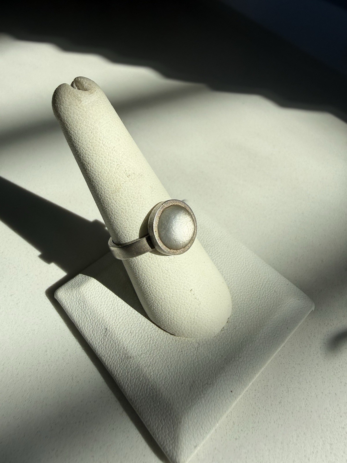 Sterling Silver Ring With a Bezel Set Matte Opaque Stone, Size 8 1/4” Approx.