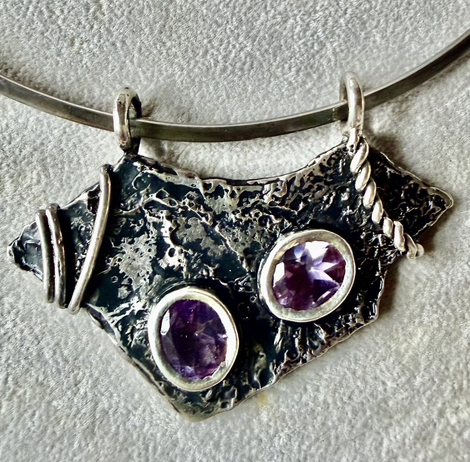 silver collar with silver and amethyst pendant