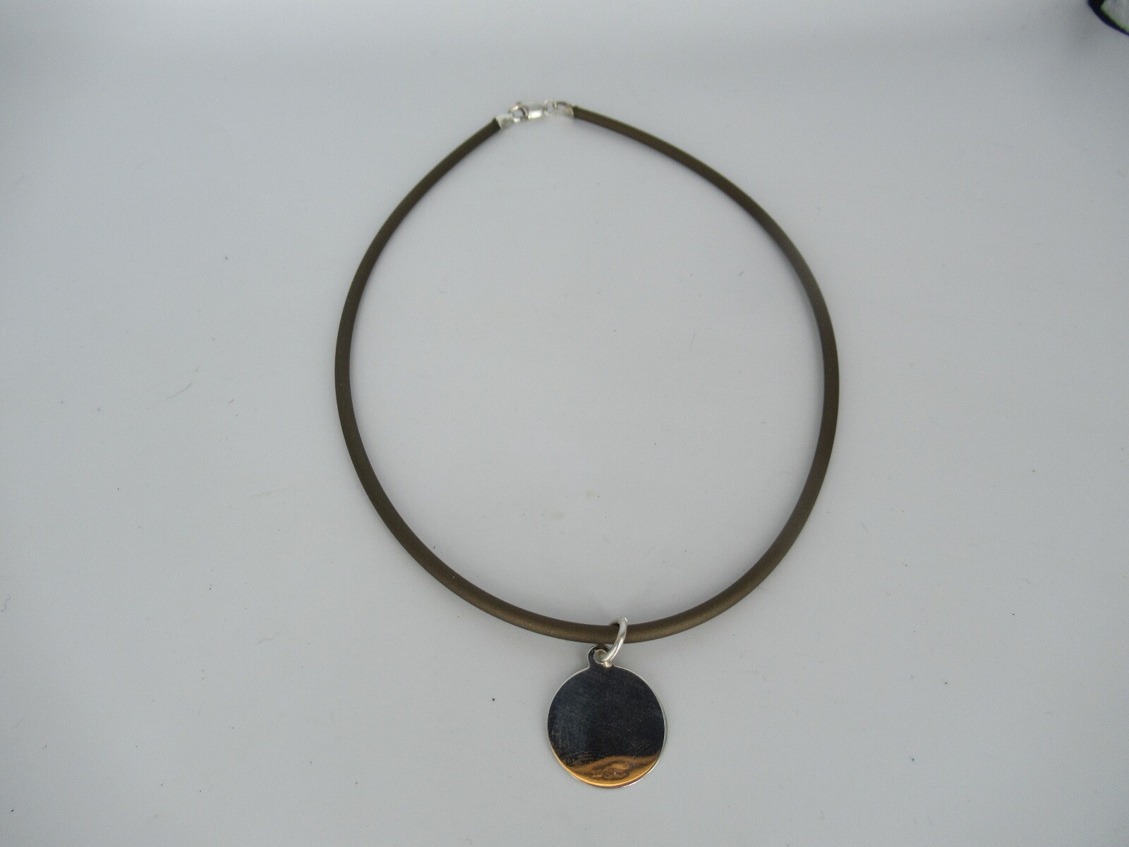 Sterling Silver Round Disc on Brown Rubber Cord