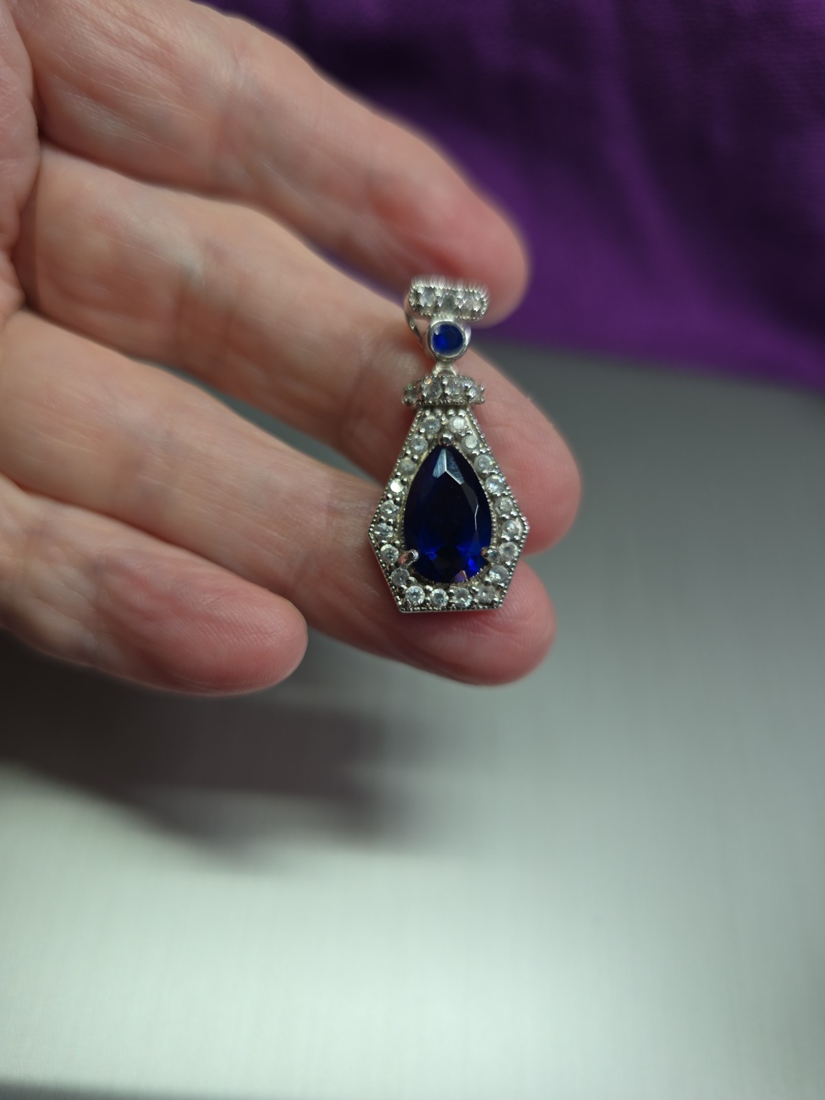 Sterling .925 Created Pear Shape Sapphire And Clear Accent Stones Pendant