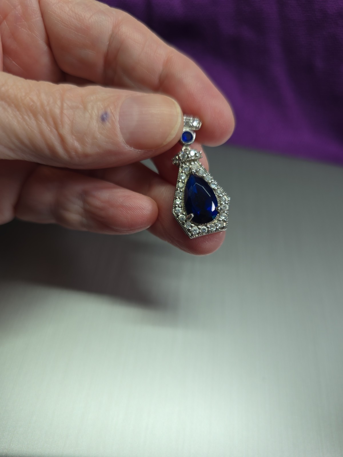 Sterling .925 Created Pear Shape Sapphire And Clear Accent Stones Pendant
