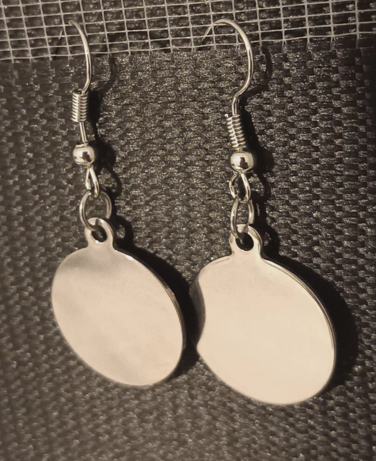 Stainless Silver round shape earing for women suitable for all occasion .